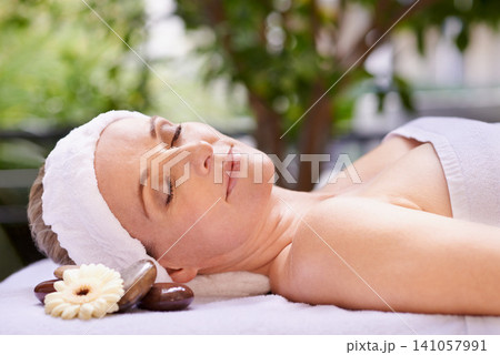 Happy woman, sleeping and relaxation with zen for skincare, stress relief or peace at spa, hotel or resort. Calm female person asleep in relax for facial, beauty or body treatment at outdoor salon Happy woman, sleeping and relaxation with zen for skincare, stress relief or peace at spa, hotel or resort. Calm female person asleep in relax for facial, beauty or body treatment at outdoor salon 141057991