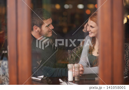 Couple, smile and holding hands on date at restaurant for bonding, romance and healthy relationship with relax. Man, woman and affection at cafe with happiness, trust and love on anniversary vacation Couple, smile and holding hands on date at restaurant for bonding, romance and healthy relationship with relax. Man, woman and affection at cafe with happiness, trust and love on anniversary vacation 141058001