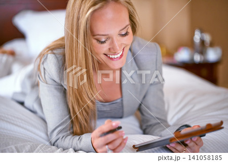 Business, woman and technology in bedroom with research for corporate planning, digital tablet and work schedule. Professional, person and happy for writing review notes and internet search in hotel 141058185