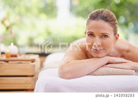 Happy woman, portrait and relax with spa, zen or massage at hotel or outdoor resort for stress relief. Face of female person with smile, enjoying facial or body treatment at accommodation in wellness Happy woman, portrait and relax with spa, zen or massage at hotel or outdoor resort for stress relief. Face of female person with smile, enjoying facial or body treatment at accommodation in wellness 141058283