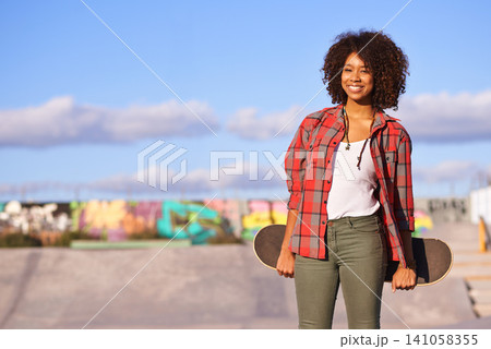 Skatepark, fashion and portrait of black woman with skateboard in urban town for exercise, training and skating. Skater, smile and happy female person for trendy, edgy and hipster clothing in city Skatepark, fashion and portrait of black woman with skateboard in urban town for exercise, training and skating. Skater, smile and happy female person for trendy, edgy and hipster clothing in city 141058355