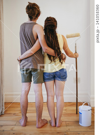 Couple, wall and painting in home for improvement together in new apartment for diy maintenance, decoration or renovation. Man, woman and back or roller for house project repair, makeover or crafting Couple, wall and painting in home for improvement together in new apartment for diy maintenance, decoration or renovation. Man, woman and back or roller for house project repair, makeover or crafting 141058360