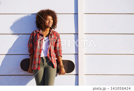 Skateboard, fashion and black woman in skatepark for exercise, training and skating in city. Skater, smile and happy female person for trendy, edgy style and hipster clothing in San Francisco 141058424