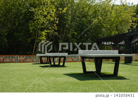 Outdoor table tennis tables in park Outdoor table tennis tables in park 141058431