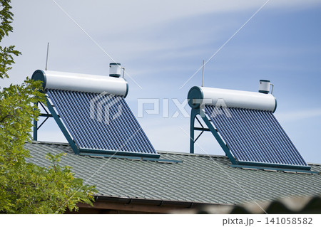 Solar Water Heaters Installed on Residential Roof Solar Water Heaters Installed on Residential Roof 141058582