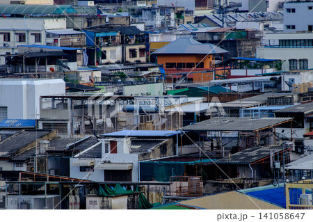 Dense old town rooftops with colorful low-rise residential buildings 141058647