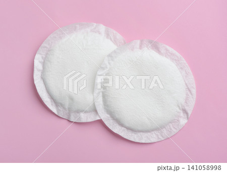 Top view of two disposable cotton nursing pads Top view of two disposable cotton nursing pads 141058998