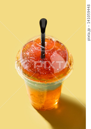 Colorful Frozen Slushie Drink in Plastic Cup 141059448