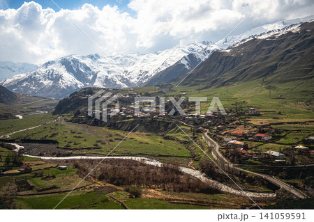 The photo shows road to the village of Stepantsminda (also known as Kazbegi). The photo shows road to the village of Stepantsminda (also known as Kazbegi). 141059591