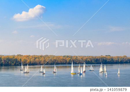 Yachts at sailing regatta on the Dnieper river in Kremenchug, Ukraine Yachts at sailing regatta on the Dnieper river in Kremenchug, Ukraine 141059879