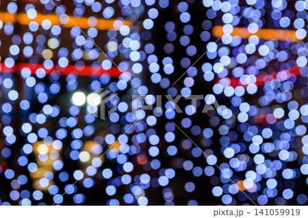 Festive multicolored blurred abstract background. Christmas lights bokeh background 141059919
