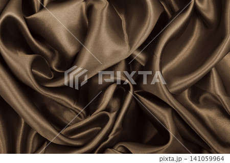 Smooth elegant brown silk or satin texture as abstract background. Luxurious background design. Sepia toned. Retro style 141059964