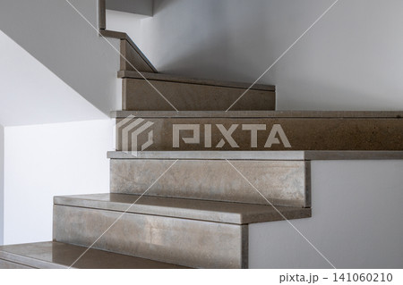 Modern stone staircase with clean lines and minimalist design Modern stone staircase with clean lines and minimalist design 141060210