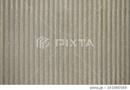 Gray ribbed concrete texture with speckled surface vertical grooved industrial background pattern 141060569