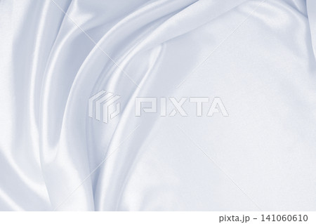 Smooth elegant grey silk or satin luxury cloth as wedding background. Luxurious background design Smooth elegant grey silk or satin luxury cloth as wedding background. Luxurious background design 141060610