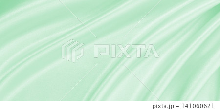 Smooth elegant green silk or satin luxury cloth texture as abstract background. Luxurious background design 141060621