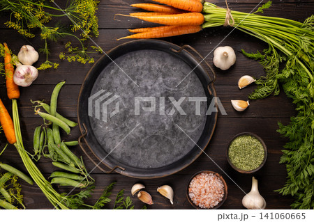 Rustic cooking board with fresh vegetables and spices Rustic cooking board with fresh vegetables and spices 141060665