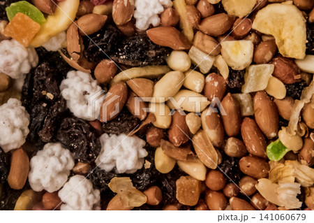 Background healthy food organic snacks dried fruits dried nuts mix ingredient 141060679