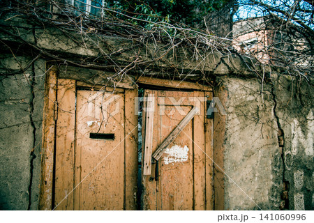 Entrance door small residential house in neighborhood, exterior building outside 141060996