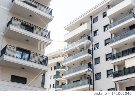 Multi storey residential building suburb city, house background sunny summer day Multi storey residential building suburb city, house background sunny summer day 141061046