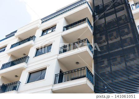 Multi storey residential building suburb city, house background sunny summer day 141061051