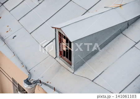 Residential building in suburbs, exterior view of roof and skylight from above Residential building in suburbs, exterior view of roof and skylight from above 141061103