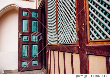 Entrance door small residential house in neighborhood, exterior building outside 141061115