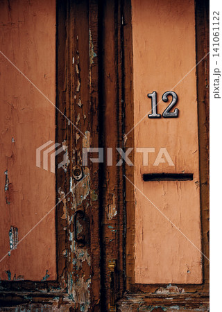 Entrance door small residential house in neighborhood, exterior building outside Entrance door small residential house in neighborhood, exterior building outside 141061122