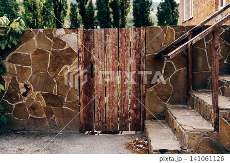 Entrance door small residential house in neighborhood, exterior building outside Entrance door small residential house in neighborhood, exterior building outside 141061126