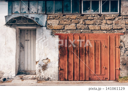 Entrance door small residential house in neighborhood, exterior building outside Entrance door small residential house in neighborhood, exterior building outside 141061129