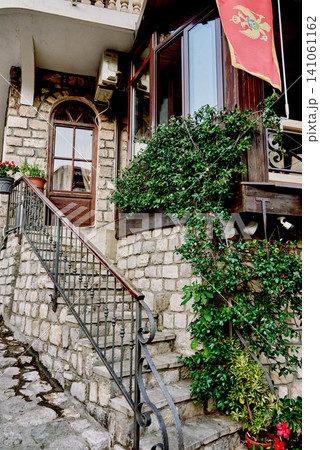 Entrance door small residential house in neighborhood, exterior building outside Entrance door small residential house in neighborhood, exterior building outside 141061162