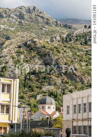 Kotor, Montenegro, Residential building and temple in mountains Kotor, Montenegro, Residential building and temple in mountains 141061183