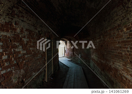 Corridor inside an old stone fortress, fortification, heritage landmark of city Corridor inside an old stone fortress, fortification, heritage landmark of city 141061269
