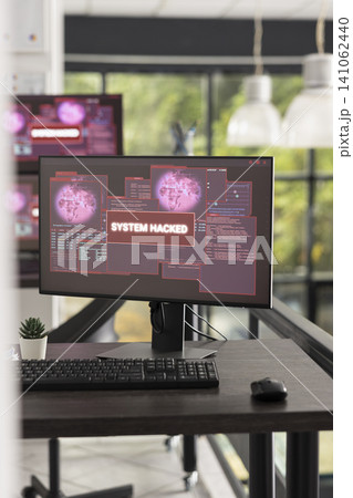 Contemporary office workspace stands empty as computer screens display system hacked messages. Visual concept emphasizes cyber threats, IT failures, and the need for strong digital protection. Contemporary office workspace stands empty as computer screens display system hacked messages. Visual concept emphasizes cyber threats, IT failures, and the need for strong digital protection. 141062440