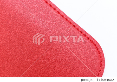 shiny red leather texture isolated on white background shiny red leather texture isolated on white background 141064082