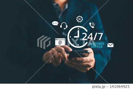 Businessman using smartphone for 24 hours 7 days customer service support. Concept of omnichannel communication, online helpline, technical assistant, and client care Businessman using smartphone for 24 hours 7 days customer service support. Concept of omnichannel communication, online helpline, technical assistant, and client care 141064925