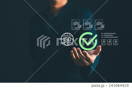 Businessman showing ISO standard quality management certification and assurance icon, guarantee compliance with international regulations and corporate business excellence workflow 141064929