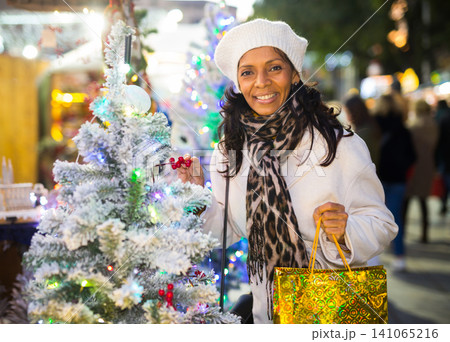 Latin woman at christmas fair Latin woman at christmas fair 141065216