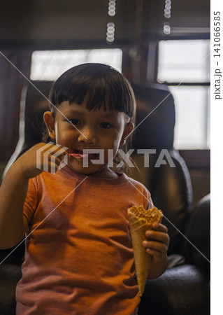 Toddler Scooping Ice Cream Toddler Scooping Ice Cream 141066585