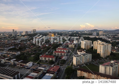 City skyline at sunset with tall buildings and cloudy sky City skyline at sunset with tall buildings and cloudy sky 141067480