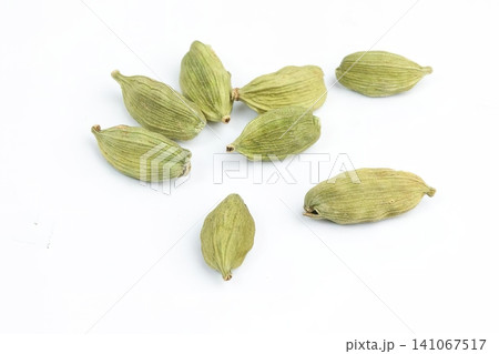 Green cardamom pods on white background Green cardamom pods on white background 141067517