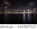 Night city skyline with tall buildings and bright lights 141067525