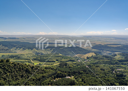 Panoramic view of the green valley and the snowy peak of Mount Elbrus on the horizon against the blue sky on a sunny clear morning in Kislovodsk Stavropol territory, Russia Panoramic view of the green valley and the snowy peak of Mount Elbrus on the horizon against the blue sky on a sunny clear morning in Kislovodsk Stavropol territory, Russia 141067550