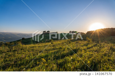 View of the mountains and Kislovodsk from the observation decks of the Kislovodsk Park. Evening sunset over the mountains of Kislovodsk. View of the mountains and Kislovodsk from the observation decks of the Kislovodsk Park. Evening sunset over the mountains of Kislovodsk. 141067570