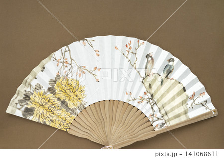 A fan featuring a traditional Korean painting and Copy Space A fan featuring a traditional Korean painting and Copy Space 141068611