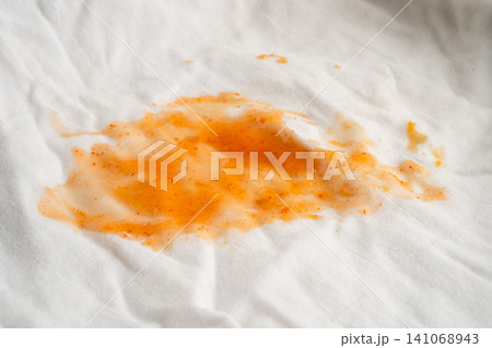 Dirty sauce stain on cloth to wash with washing powder, cleaning housework. Dirty sauce stain on cloth to wash with washing powder, cleaning housework. 141068943