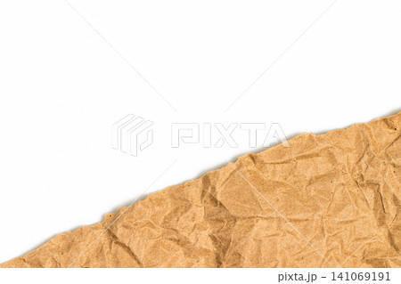 Diagonal torn crumpled brown kraft paper edge with white copy space. Ripped recycled cardboard sheet layer background for creative organic banner design element Diagonal torn crumpled brown kraft paper edge with white copy space. Ripped recycled cardboard sheet layer background for creative organic banner design element 141069191