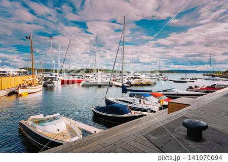 Aker Brygge Marina with moored boats and yachts in Oslo Aker Brygge Marina with moored boats and yachts in Oslo 141070094