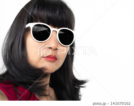 Woman sunglasses brown Hair lifestyle travel summer tropical, young people face skin tan model Portrait girl pretty posing, eye patch pterygium surgery eye medical,concept for health. Woman sunglasses brown Hair lifestyle travel summer tropical, young people face skin tan model Portrait girl pretty posing, eye patch pterygium surgery eye medical,concept for health. 141070102