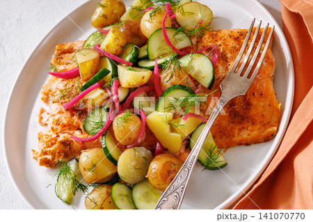 Baked salmon fillet, new potatoes, pickled onion Baked salmon fillet, new potatoes, pickled onion 141070770